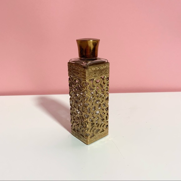 Vintage ornate brass empty bottle